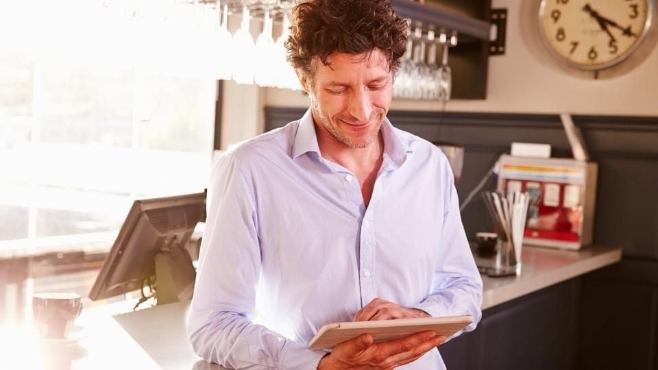 restaurant owner at his counter